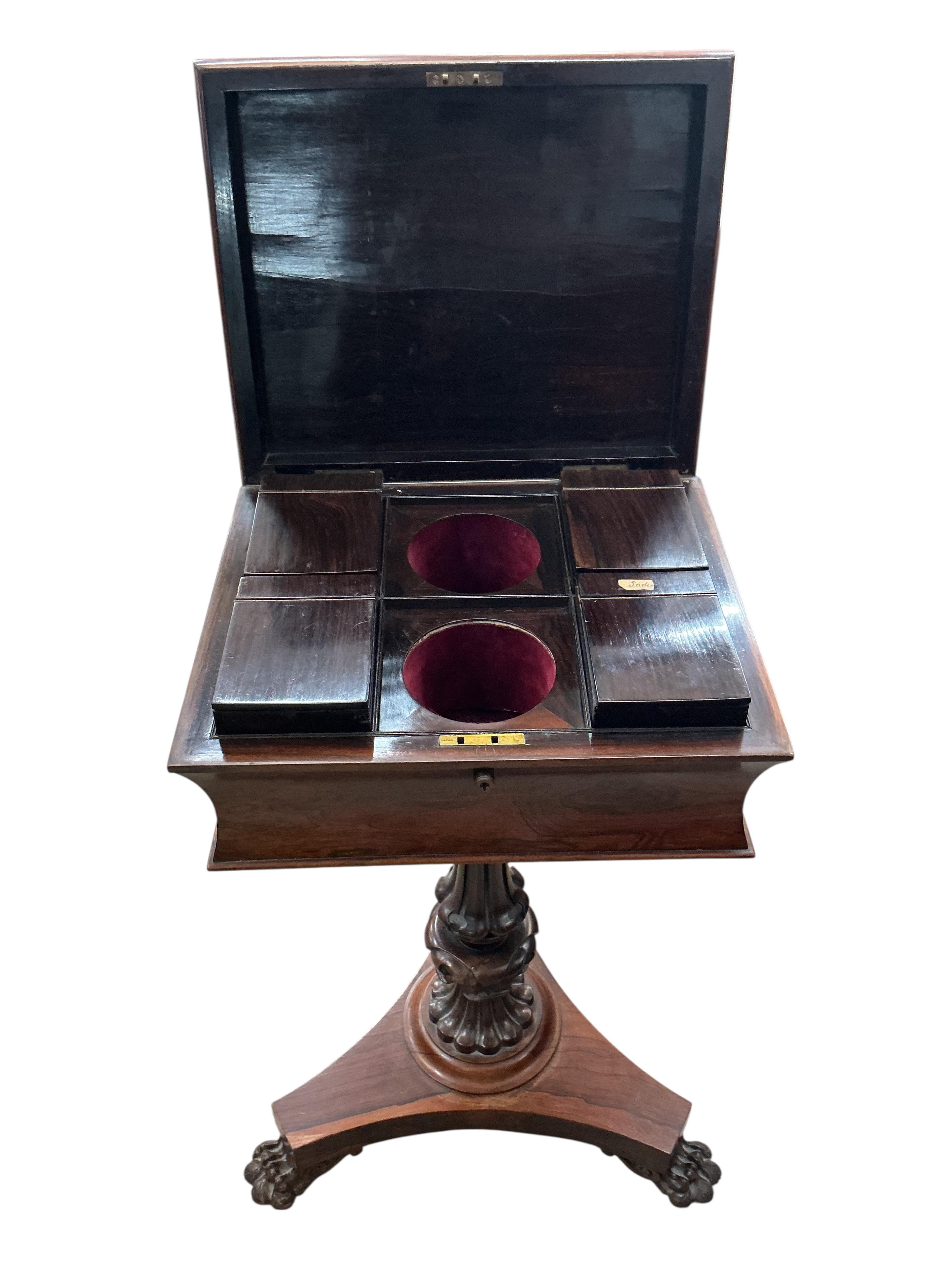 An early Victorian rosewood teapoy, on triangular platform and lion's paw feet, width 40cm, depth 33cm, height 78cm
